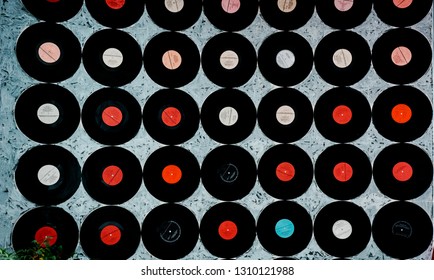 Vinyl Records Mounted On Painted Wall. Retro Design.