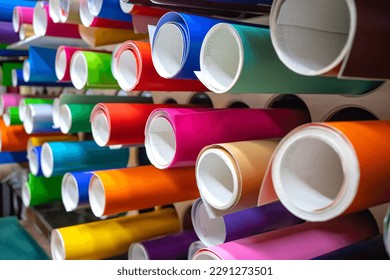 Vinyl self-adhesive film on the shelves of the store.Sale of multi-colored film for design and visual design. External tuning.