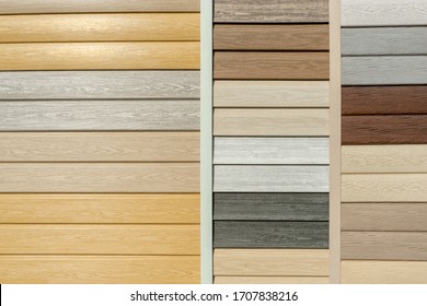 Vinyl Siding With Imitation Wood Texture In Bright Palette Of Colors. Plastic Wall Covering For Exterior Decoration Of House. Abstract Background For Your Design With Copy Space And Place For Text.