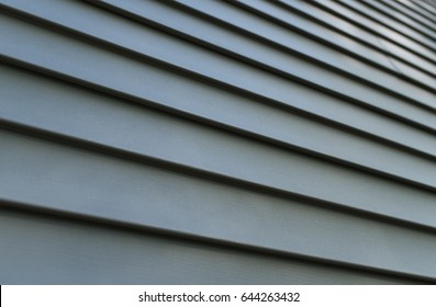 Vinyl Siding Texture And Background In Residential Neighborhood Housing. Real Estate Background Concept