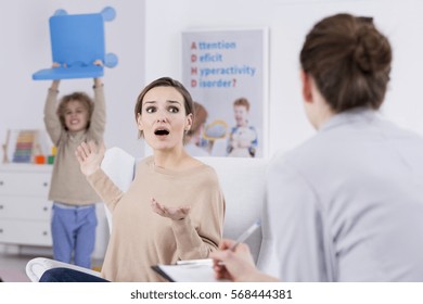 Violent Child And Terrified Mother During Session With Psychologist