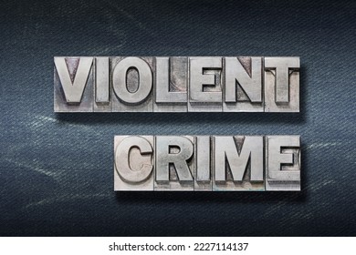 violent crime phrase made from metallic letterpress on dark jeans background - Shutterstock ID 2227114137