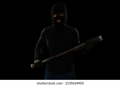 Violent Criminal With A Black Mask Making Eye Contact While Carrying A Baseball Bat For A Fight