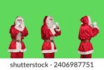 Violent saint nick throw punches in the air, acting aggressive with clenched fists. Strong santa claus character in costume ready for fight, confident person cosplay on greenscreen.