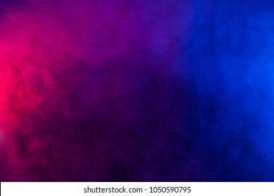 Violet and blue smoke texture on a black background. Texture and abstract art