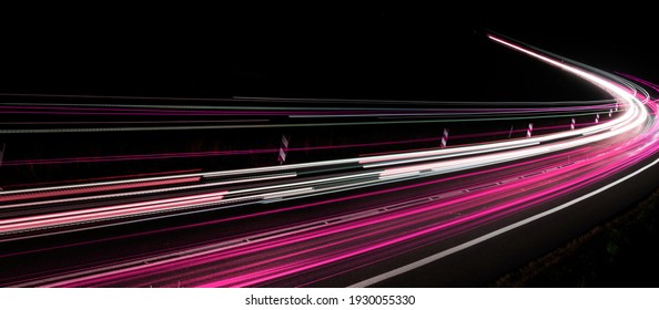 Violet Car Lights At Night. Long Exposure