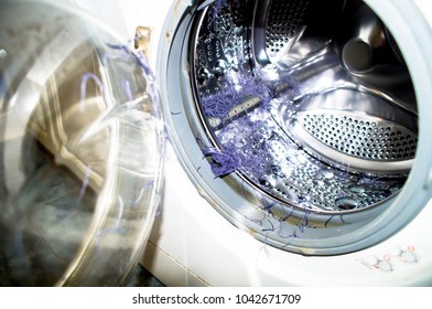violet color cotton pieces inside the waching machine