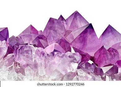 Violet Crystal Stone macro mineral surface. Purple rough Amethyst quartz crystals geode on white background, Uruguay