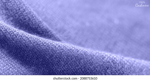 Violet luxury pure cashmere texture. Blurred background with copy space. Cashmere in trendy color 2022 Very Peri.