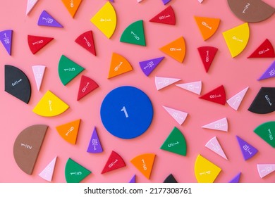 Violet orange yellow pieces of fractions on a table. Close up math material for study. Back to school, geometry lessons, mathematical education for preschooler. Creative study. background with numbers - Shutterstock ID 2177308761