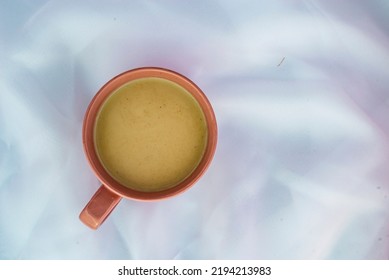 Violet Orchid Flower Pink Cup Of Latte Coffee With Milk White Tulle  Wood Background, Top View Flatlay Morning