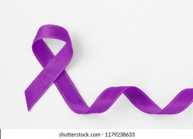 Violet ribbon on white background - Concept of Domestic Violence awareness; Alzheimer's disease, Pancreatic cancer, Epilepsy awareness and Hodgkin's Lymphoma