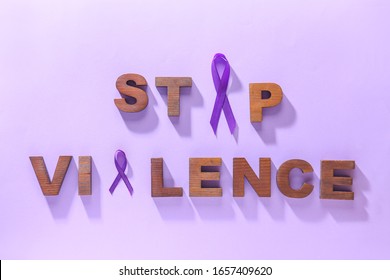 Violet ribbons and text DOMESTIC VIOLENCE on color background