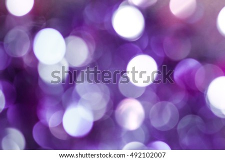 violet and white bokeh background.