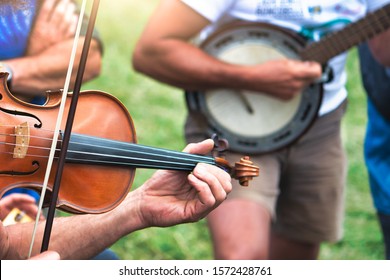 Violin And Banjo Played Outdoors In A Popular Country Party