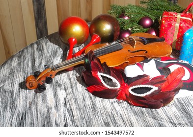 Violin, Carnival Masks, Maracas, Branches Of Spruce And Christmas Decorations. Happy New Year!
