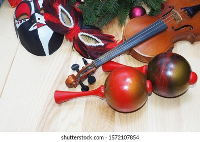 Violin, Carnival Masks, Maracas, Spruce Branch And Christmas Decorations.