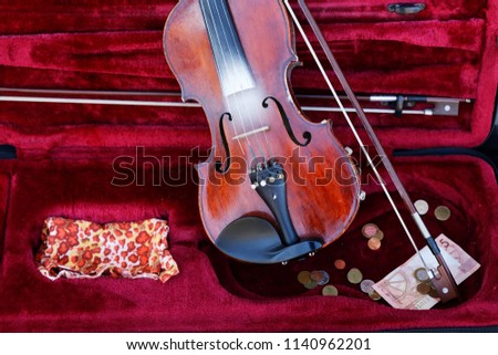 violin case with money