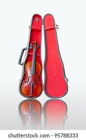 Violin and case on white background