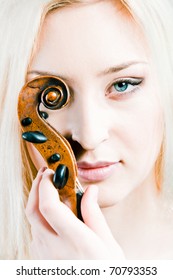 Violin Music Portrait Of Beautiful Girl With Blue Eye In High Key. Blonde Woman Looking At Camera.