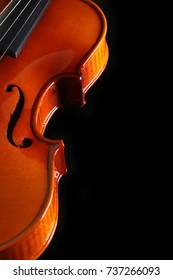Violin on black background with blank copy space.