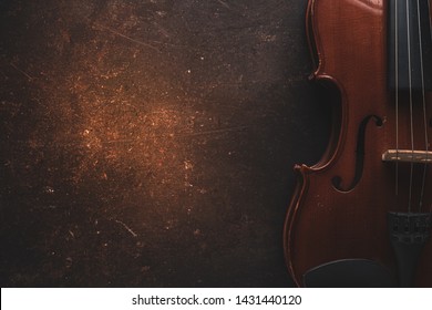 Violin on a black background,Classical violin isolated on dark background. Studio shot of old violin. Classical musical instrument,Top view violin black background