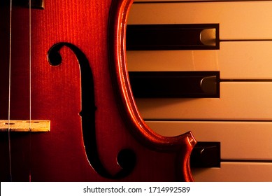 violin on electric piano with candle light.
