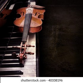 Violin on the piano on a grunge background