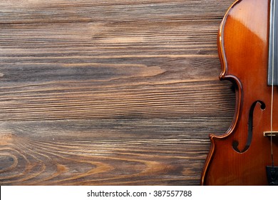 Violin On Wooden Background