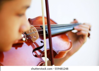 Violin play with blur face.