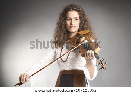 Violin player violinist playing classical music. Orchestra instruments