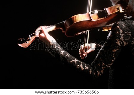 Violin player. Violinist playing violin Hands with musical instrument close up