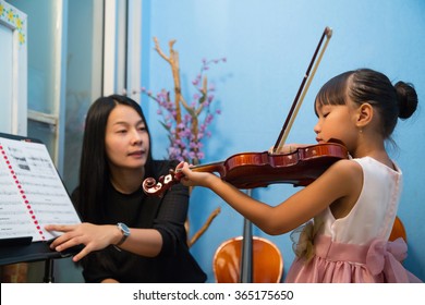 Violin Teacher Teach Music In School