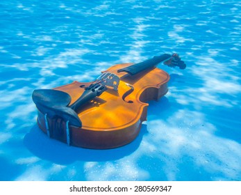 Violin underwater in the swimming pool