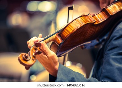 A Violinist In Concert With An Orchestra