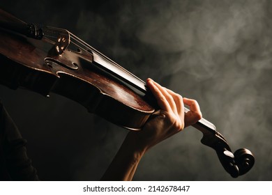 Violinist hands playing violin orchestra musical instrument closeup