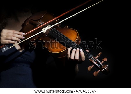 Violinist holding in your hands the violin. 