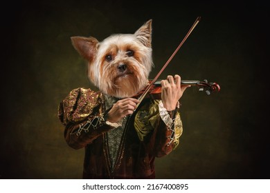 Violinist. Model like medieval royalty person in vintage clothing headed by dog head isolated on dark vintage background. Comparison of eras, artwork, renaissance, baroque style. Contemporary collage.