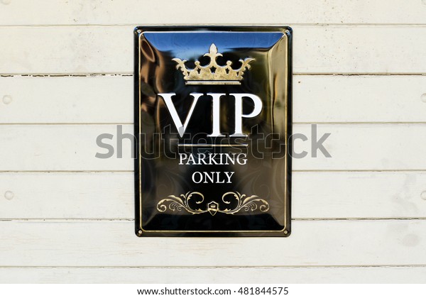 VIP parking only sign.\
First class reserved parking. VIP Very Important People special\
parking space.