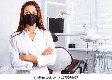 Viral Infection. Laboratory. Doctor In A Black Mask. Dentist At The Clinic. Coronavirus.