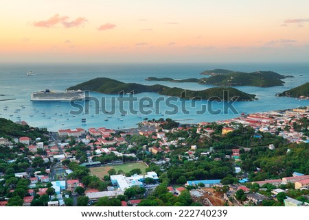 Virgin Islands St Thomas sunrise with colorful cloud, buildings and beach coastline. 