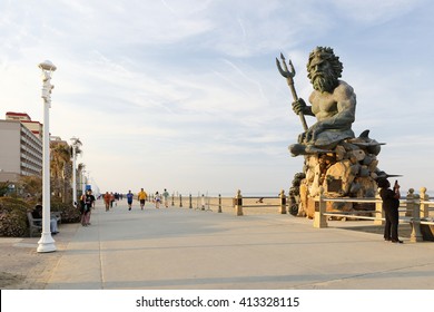 Virginia Beach, Virginia - April, 2016: The King Neptune Statue at Virginia Beach Before Sunset. King Neptune is a large bronze statue sculpted by Paul DiPasquale located in Virginia Beach, Virginia.