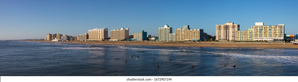 Virginia Beach, city in the state of Virginia, at the Atlantic coast, United States of America, during clear sky, and surfers enjoying the waves
