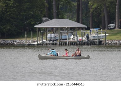 Virginia Beach, Virginia, USA - May 15, 2022: A Family Out Canoeing On The Water In Virginia Beach.