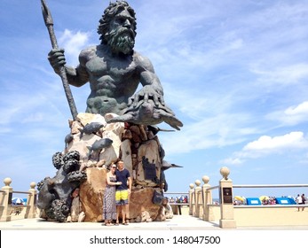 VIRGINIA BEACH, VA - JULY 21: Neptune Sculpture at on July 21, 2013 at Virginia Beach, VA USA. A 34-foot, cast bronze Neptune statue stands at the gateway to Neptune Park and the threshold of the sea