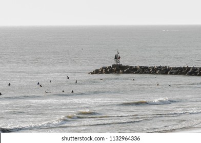 Virginia Beach, VA-August 31, 2017: People Surfing In The Surf Of The Ocean At Virginia Beach, VA.