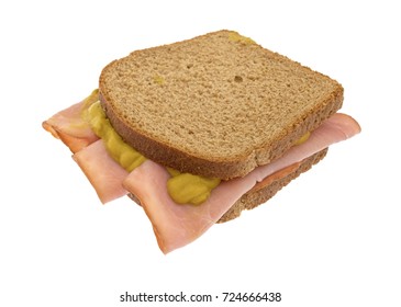 Virginia Ham Sandwich On Wheat Bread With Mustard Isolated On A White Background.