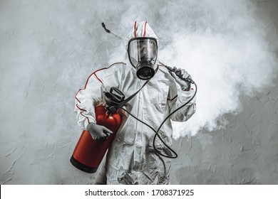virologist in protective hazmat suit conducts disinfections of surfaces in public and isolated places, pandemic health risk, coronavirus covid-19 concept