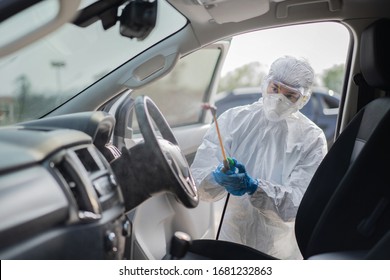 Virologist Scientists Wearing PPE Kits Are Cleaning The Virus In Cars.