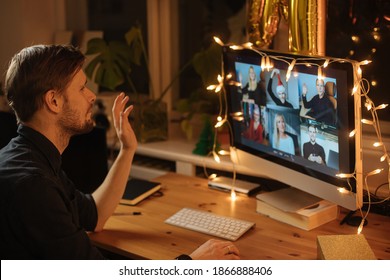 Virtual Christmas New Year's Eve Party. Man Smiling Wearing Business Video Conferencing Young Man Having Video Call Via Computer In The Home Office Online Team Meeting Remote Conference Calling. 